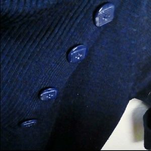 Figure hugging blue triangle button collar sweater